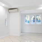 air conditioning in a room with white tiles